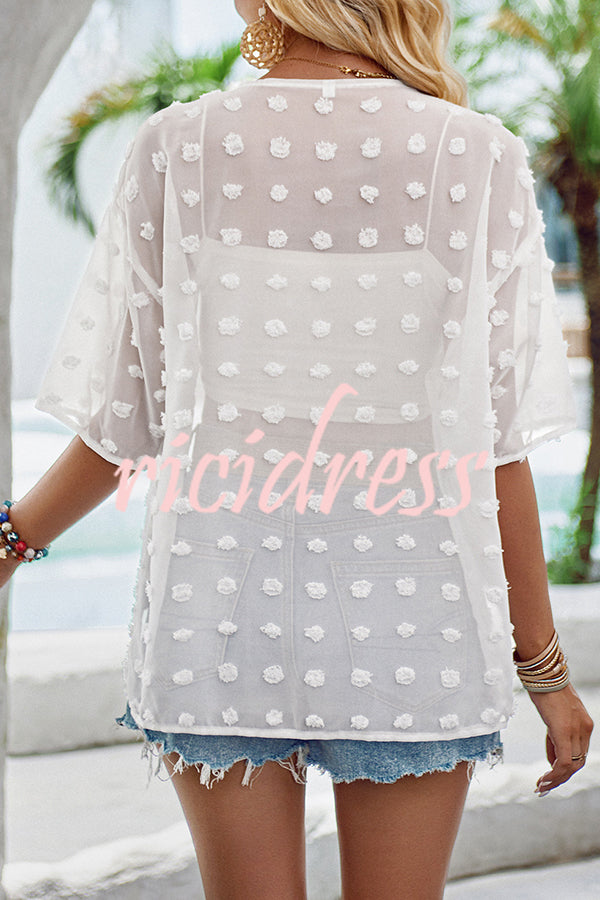 durchsichtiger Überwurf mit Patchwork-Pom-Pom-Ärmeln