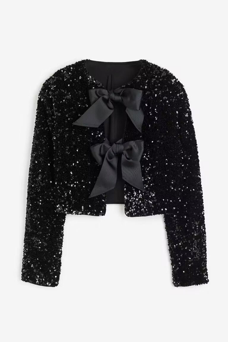 Manteau Cara à paillettes et nœud papillon
