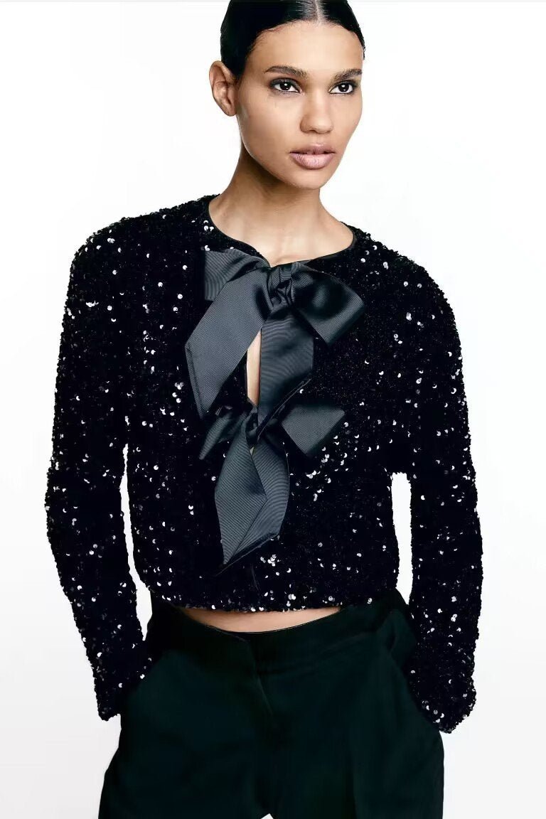 Manteau Cara à paillettes et nœud papillon