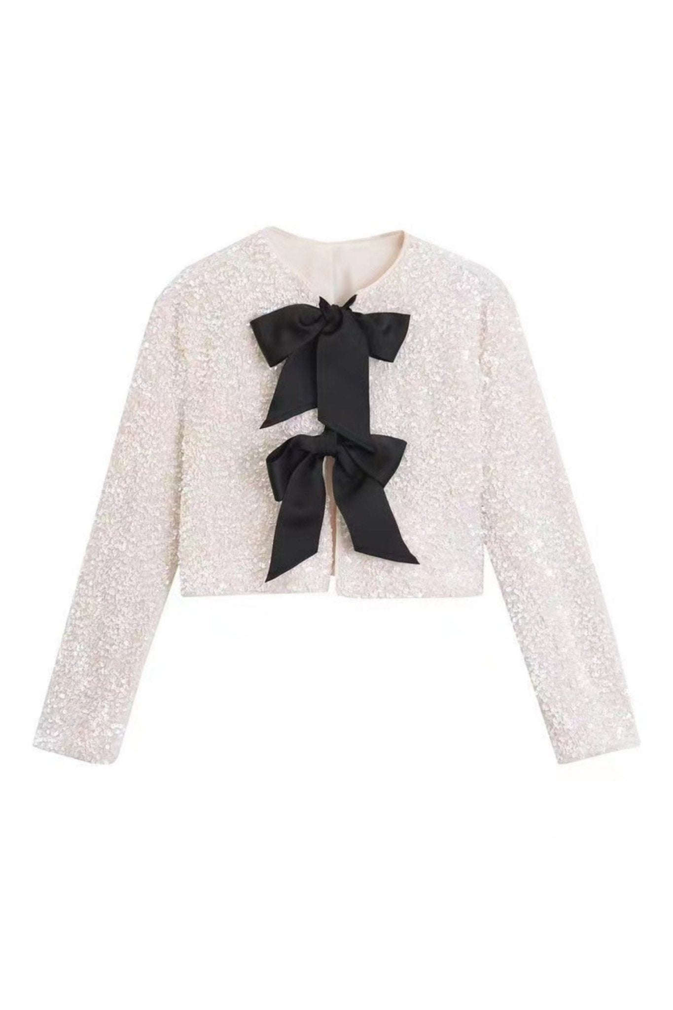 Manteau Cara à paillettes et nœud papillon